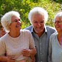 A diverse group of cheerful older adults engaging in outdoor activities, symbolizing healthy aging