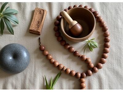 Meditation cushions and sound bowls, symbolizing mindfulness tools